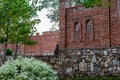 Unfinished red brick construction, old and textured stone. Large oval openings for the Windows, Royalty Free Stock Photo