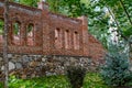 Unfinished red brick construction, old and textured stone. Large oval openings for the Windows, Royalty Free Stock Photo