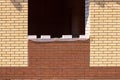 Unfinished red brick house wall . Window house on construction site. Brickwork Royalty Free Stock Photo