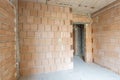 Unfinished room interior of building under construction. Brick red walls. New home Royalty Free Stock Photo