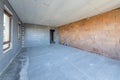 Unfinished room interior of building under construction. Brick red walls. New home Royalty Free Stock Photo