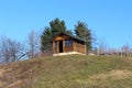 Unfinished small wood cabin on top of the hill
