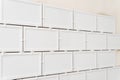 Unfinished white ceramic tiles with tile spacers. Concept of a kitchen renovation. Royalty Free Stock Photo