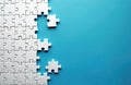 Unfinished white jigsaw puzzle on blue background with copy space. Missing pieces wait for connection. Image represents problem Royalty Free Stock Photo