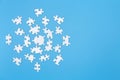 Unfinished white jigsaw puzzle pieces on blue background,  Copy space Royalty Free Stock Photo