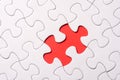 Unfinished white jigsaw puzzle pieces on red background Royalty Free Stock Photo