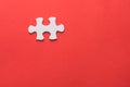 Unfinished white jigsaw puzzle pieces on red background Royalty Free Stock Photo