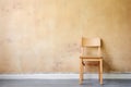 unfinished wooden chair against wall