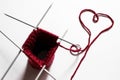 Unfinished wool and knitting needle design. Red thread and tangle. Handmade concept. Craft banner. Love, romantic, valentines day Royalty Free Stock Photo