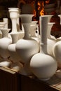 Unfired greenware vases and pots