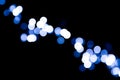 Unfocused abstract colourful bokeh black background. defocused and blurred many round blue light