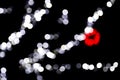 Unfocused abstract colourful bokeh with red and blue lamp on black background. defocused and blurred many round light