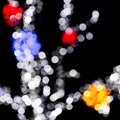 Unfocused abstract colourful bokeh with red, green, orange and blue lamp on black background. defocused and blurred many round Royalty Free Stock Photo