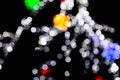 Unfocused abstract colourful bokeh with red, green, orange and blue lamp on black background. defocused and blurred many round Royalty Free Stock Photo