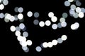 Unfocused abstract white bokeh on black background. defocused and blurred many round light Royalty Free Stock Photo