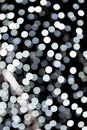 Unfocused abstract white bokeh on black background. defocused and blurred many round light Royalty Free Stock Photo