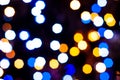 unfocused blurred multicolored christmas shiny lights on dark background for wallpaper Royalty Free Stock Photo