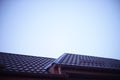 Unfocused brown metal roof under a blue sky