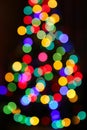 Unfocused Christmas tree with colorful lights Royalty Free Stock Photo