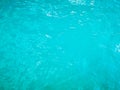 Unfocused green blue turquoise rippled water texture, top view. Natural bright background Royalty Free Stock Photo