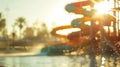 Unfocused haze of sunsoaked pools and towering slides Royalty Free Stock Photo