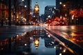 An unfocused image of an urban road at nighttime, filled with moving cars and a clock-bearing structure on the Royalty Free Stock Photo