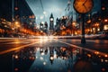 An unfocused image of an urban road at nighttime, filled with moving cars and a clock-bearing structure on the Royalty Free Stock Photo