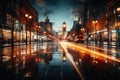 An unfocused image of an urban road at nighttime, filled with moving cars and a clock-bearing structure on the Royalty Free Stock Photo