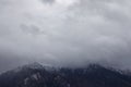 Unfocused misty mountain moody landscape wallpaper view gray cloudy sky background Royalty Free Stock Photo