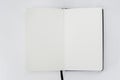 Unfold open notebook with blank white pages on light back. Sketchbook, book