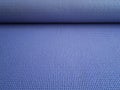 Unfolded Mat for fitness, Pilates or yoga. Purple Mat for sports training Royalty Free Stock Photo