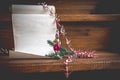 Unfolded roll of old empty paper with vintage glass toy and decor on wooden stairs. Christmas postcard template