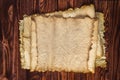 Scrolls of old paper on a wooden table. Antique background Royalty Free Stock Photo