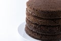 Unfrosted chocolate cake layers isolated on white background Royalty Free Stock Photo