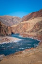 Unfrozen clear river water running through canyon in winter