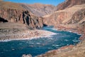 Unfrozen clear river water running through canyon in winter