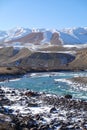 Unfrozen clear river water running through canyon in winter