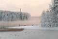 Unfrozen lake in the winter forests