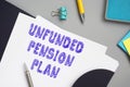 UNFUNDED PENSION PLAN inscription on the piece of paper Royalty Free Stock Photo