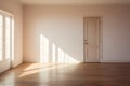 An unfurnished room in a new apartment filled with sunshine light. Interior of an empty bright room with floor, concrete wall and