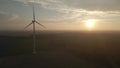 Wind power at sunset, green renewable and sustainable energy from a turbine