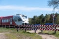 Unguarded level crossing with passing train