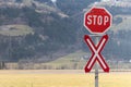 An unguarded level crossing there is a stop sign and an Andreas cross Royalty Free Stock Photo