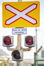 Unguarded level crossing traffic sign for trains. 3 traffic lights. information panel, "pare ao sinal vermelho"