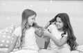 Unhand my hair. Naughty children pull on hair. Beauty look of little girls. Hair salon. Home clothing and leisure wear