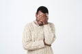 Unhappy african man covering his eyes by hand over gray background Royalty Free Stock Photo