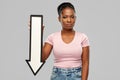 Unhappy african woman with downwards arrow