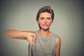 Unhappy, angry, off woman, annoyed giving thumbs down gesture Royalty Free Stock Photo