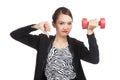 Unhappy Asian business woman thumbs down with dumbbells Royalty Free Stock Photo