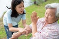 Unhappy asian child girl comfort upset offended senior grandmother,female teenager is stressed to trying to reconcile or